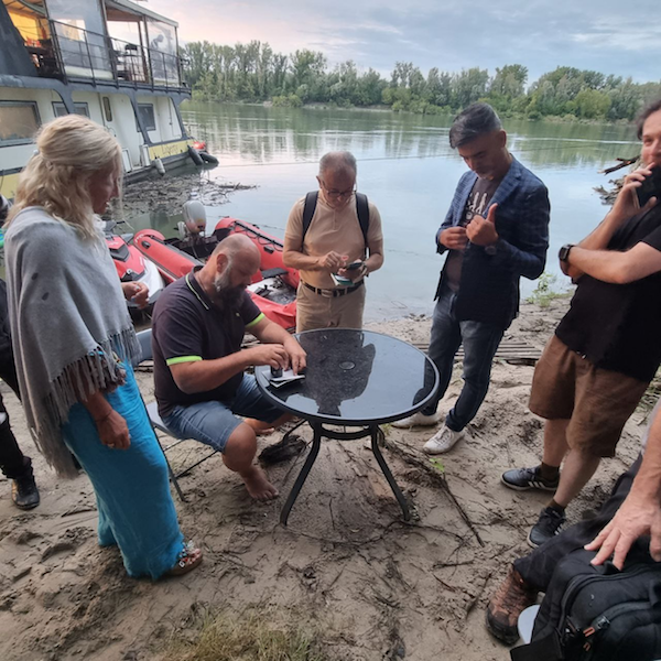 Passports, including from America an Sweden, being stamped as people prepare to board the Liberland houseboat